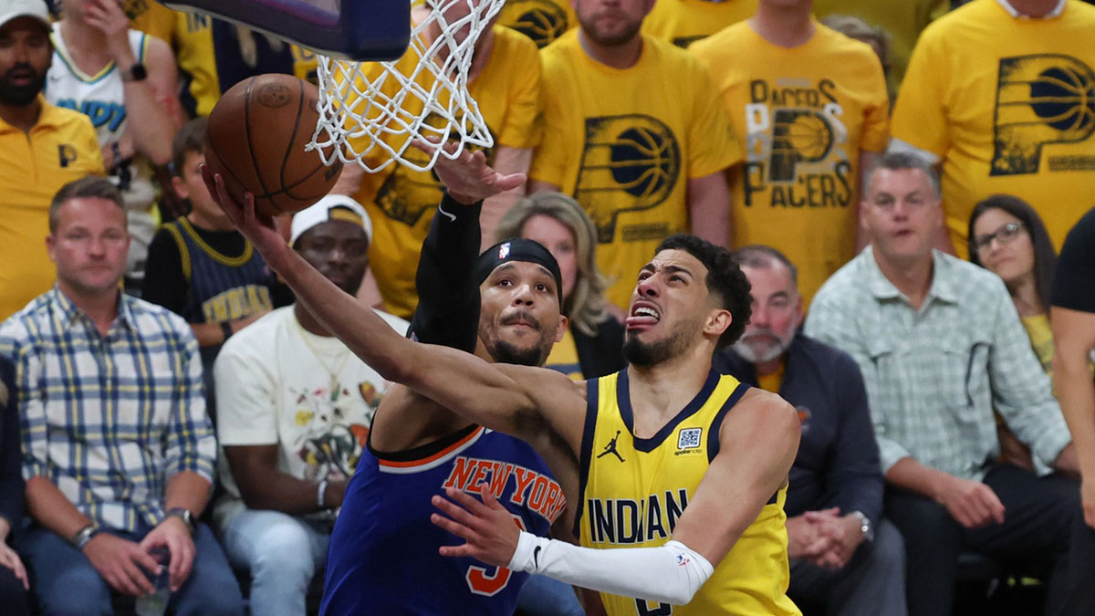 Indiana Pacers guard Tyrese Haliburton (0) shoots the ball against New York Knicks guard Josh Hart (3) in the fourth quarter during game six of the eastern conference finals for the 2025 NBA Playoffs at Gainbridge Fieldhouse.