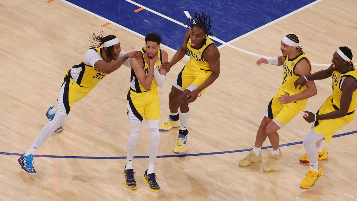 Indiana Pacers guard Tyrese Haliburton (0) celebrates with teammates after tying the game in the fourth quarter to send the game to overtime against the New York Knicks during game one of the eastern conference finals for the 2025 NBA Playoffs at Madison Square Garden.