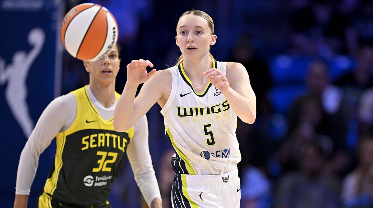 Dallas Wings guard Paige Bueckers (5) receives a pass as Seattle Storm forward Alysha Clark (32) looks on during the second half at College Park Center.