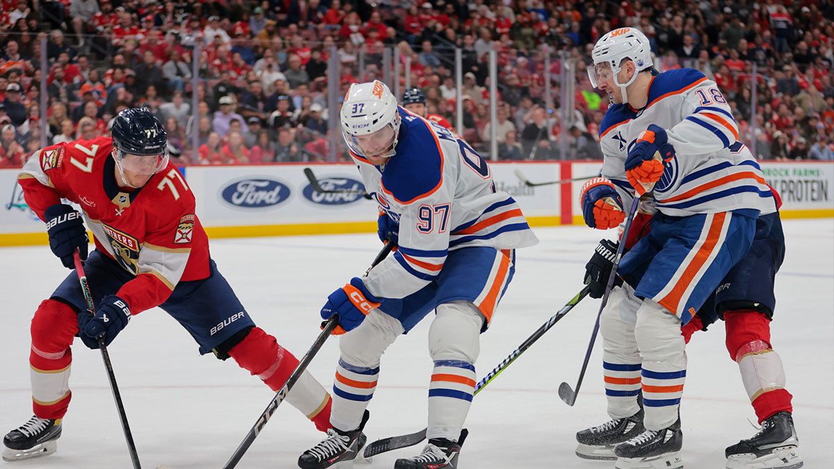 Edmonton Oilers center Connor McDavid (97) moves the puck as Florida Panthers defenseman Niko Mikkola (77) defends during the third period at Amerant Bank Arena.