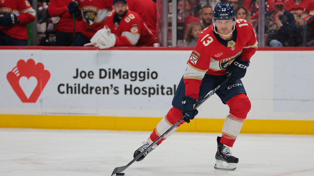 Florida Panthers center Sam Reinhart (13) moves the puck against the Tampa Bay Lightning during the second period at Amerant Bank Arena.