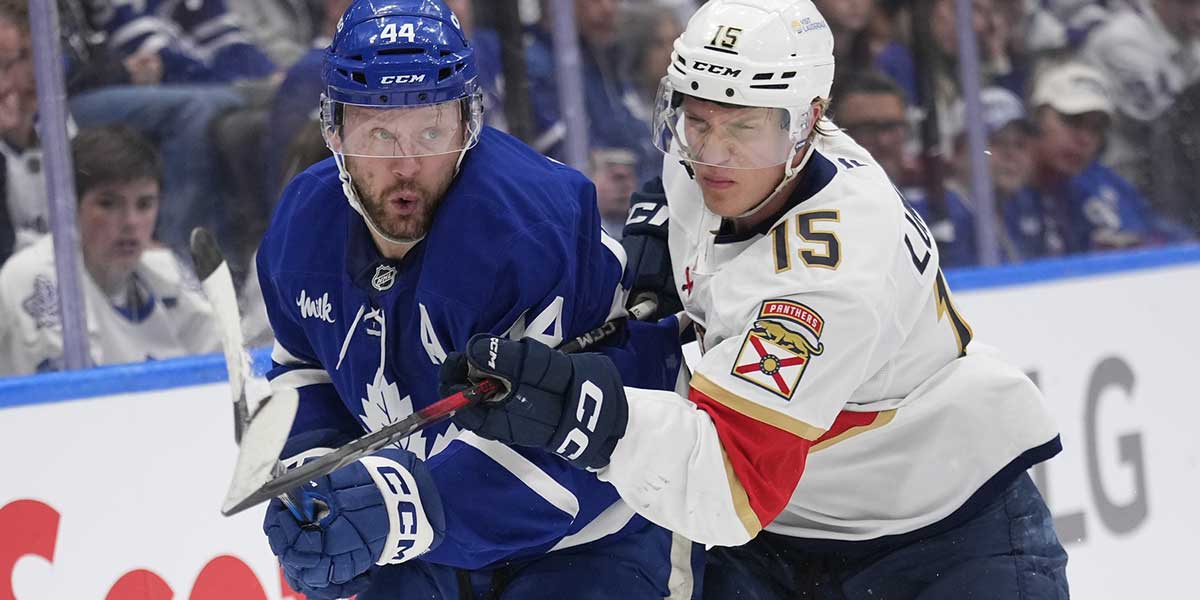 Florida Panthers forward Anton Lundell (15) checks Toronto Maple Leafs defenceman Morgan Rielly (44) during the second period of game seven of the second round of the 2025 Stanley Cup Playoffs at Scotiabank Arena.