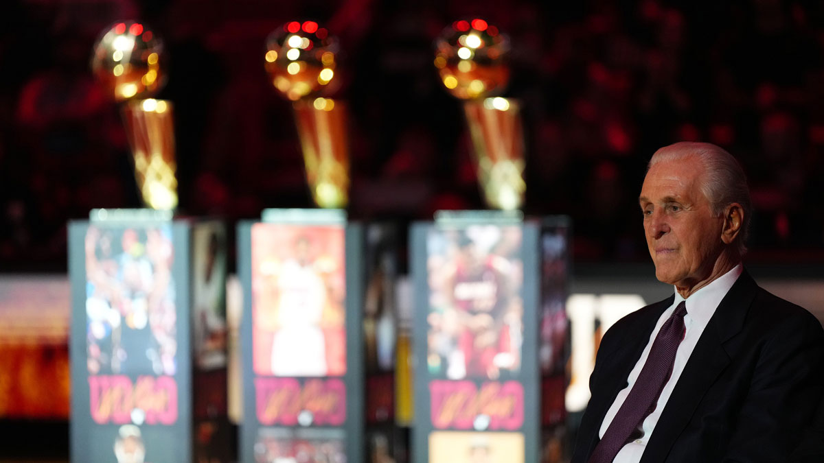 Miami Heat president Pat Riley sits on the court for the jersey retirement ceremony for former player Udonis Haslem during halftime of the game between the Miami Heat and the Atlanta Hawks Kaseya Center.