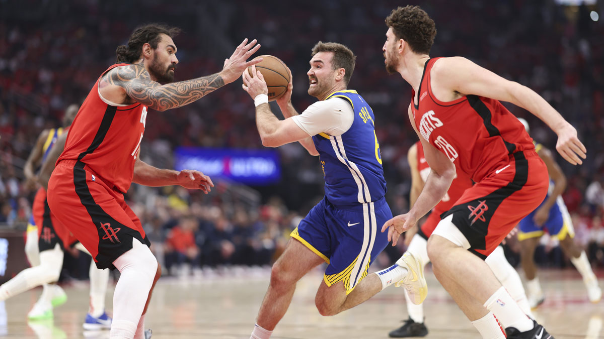 Golden State Warriors guard Pat Spencer (61) drives with the ball as Houston Rockets center Steven Adams (12) defends during game two of the first round for the 2024 NBA Playoffs at Toyota Center.