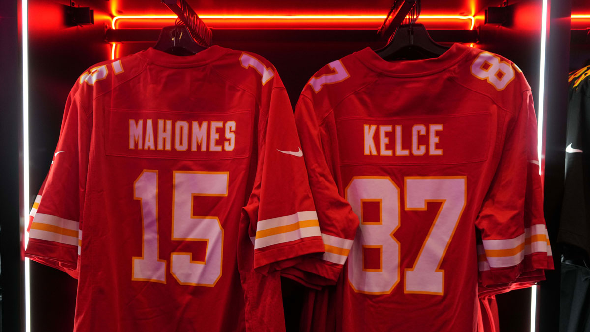 The Nike football jerseys of Kansas City Chiefs quarterback Patrick Mahomes (15) and tight end Travis Kelce (87) at the NFL Shop at the Super Bowl LIX Experience at the Ernest N. Morial Convention Center.
