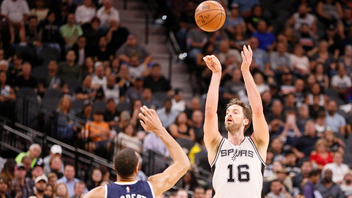 San Antonio Spurs center Pau Gasol (16) shoots the ball over Utah Jazz center Rudy Gobert (27) during the second half at AT&T Center.