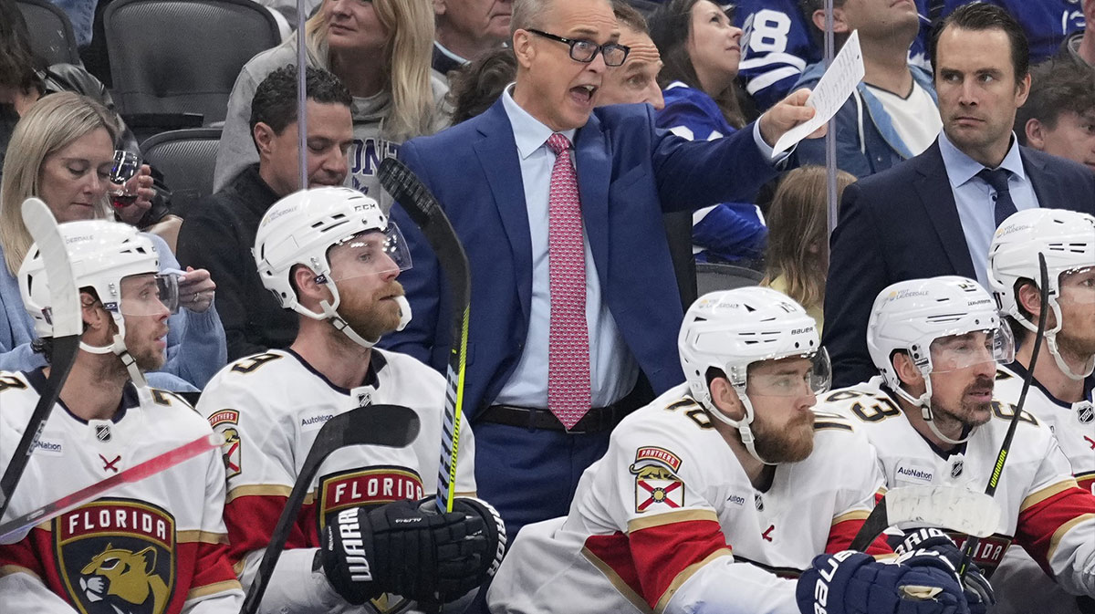 Florida Panthers head coach Paul Maurice (blue suit) calls out instructions during the third period of game seven of the second round of the 2025 Stanley Cup Playoffs against the Toronto Maple Leafs at Scotiabank Arena.