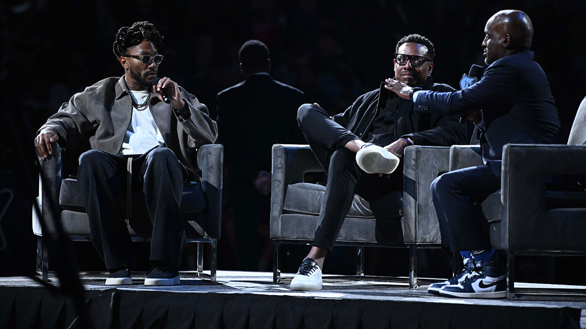 Derrick Rose (left) and Paul Pierce (right) being interviewed by Brevin Knight at the Tony Allen jersey retirement ceremony after the Miami Heat vs. Memphis grizzlies game at FedExForum.