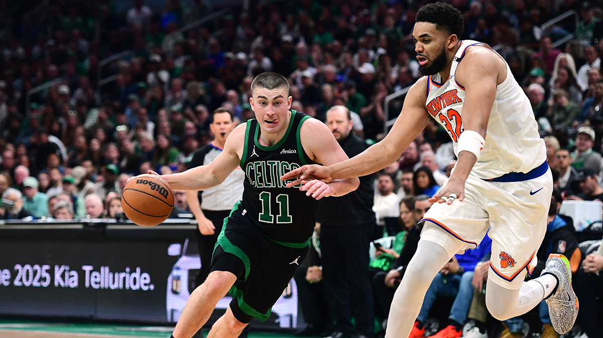 Boston Celtics guard Payton Pritchard (11) controls the ball while New York Knicks center Karl-Anthony Towns (32) defends in the second half during game five of the second round for the 2025 NBA Playoffs at TD Garden.