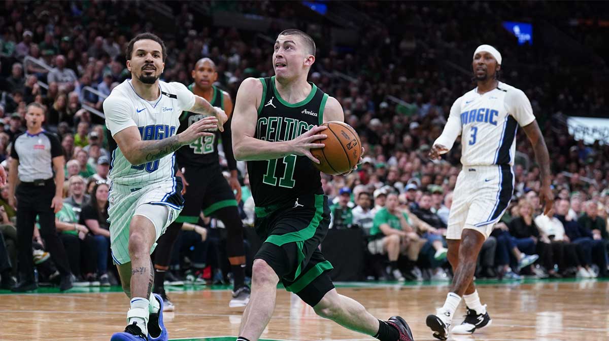 Boston Celtics guard Payton Pritchard (11) drives the ball against Orlando Magic guard Cole Anthony (50) in the third quarter during game five of first round for the 2025 NBA Playoffs at TD Garden.