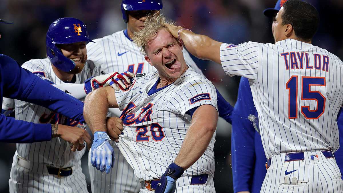 New York Mets first baseman Pete Alonso (20) celebrates with teammates after his ninth inning walkoff RBI sacrifice fly against the Pittsburgh Pirates at Citi Field.