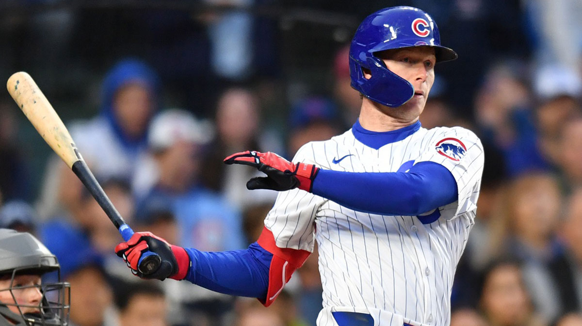 Chicago Cubs center fielder Pete Crow-Armstrong (4) hits a sacrifice ground out RBI during the third inning against the Colorado Rockies at Wrigley Field.