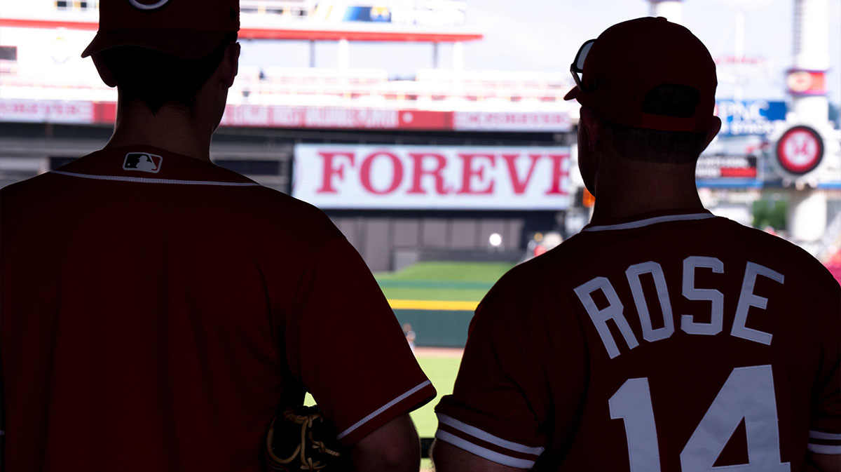 Fans look on wearing Pete Rose’s jersey