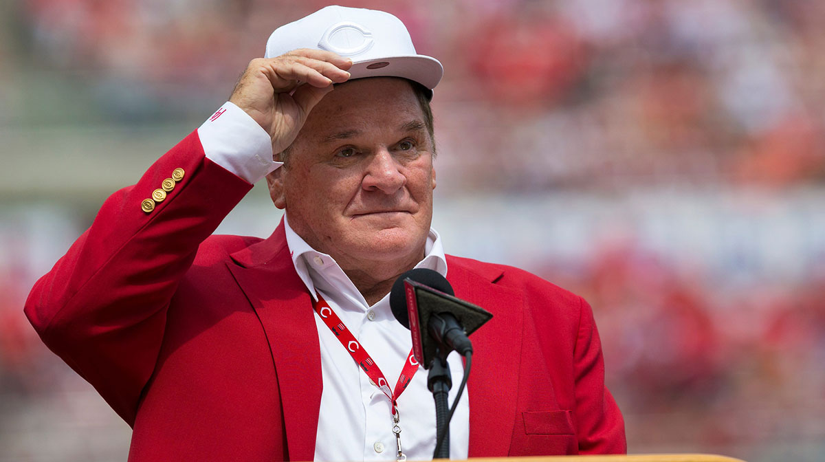 An emotional Cincinnati Reds hall of famer Pete Rose adjusts his cap as he takes the microphone during a pregame ceremony for the unveiling of Pete Rose's bronze statue being installed outside the stadium before the MLB National League game between the Cincinnati Reds and the Los Angeles Dodgers at Great American Ball Park in downtown Cincinnati on Saturday, June 17, 2017.