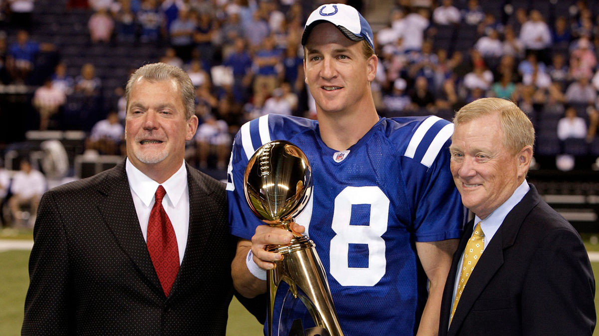 Colts owner Jim Irsay, left, and Colts President Bill Polian, right, congratulates Indianapolis Colts' Peyton Manning on winning the 2008 NFL MVP during a halftime ceremony. The Indianapolis Colts host the Philadelphia Eagles at Lucas Oil Stadium in Indianapolis, IN on Thursday night, August 20, 2009 in their second preseason game.