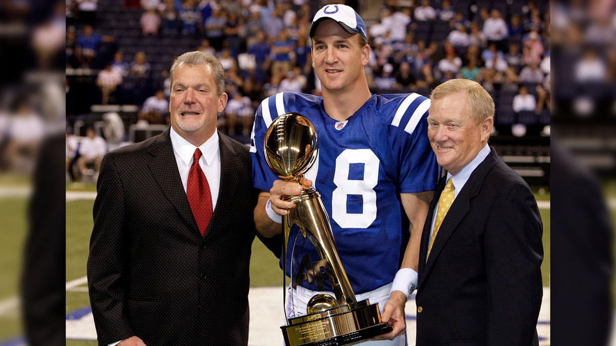 Colts owner Jim Irsay, left, and Colts President Bill Polian, right, congratulates Indianapolis Colts' Peyton Manning on winning the 2008 NFL MVP during a halftime ceremony. The Indianapolis Colts host the Philadelphia Eagles at Lucas Oil Stadium in Indianapolis, IN on Thursday night, August 20, 2009 in their second preseason game.