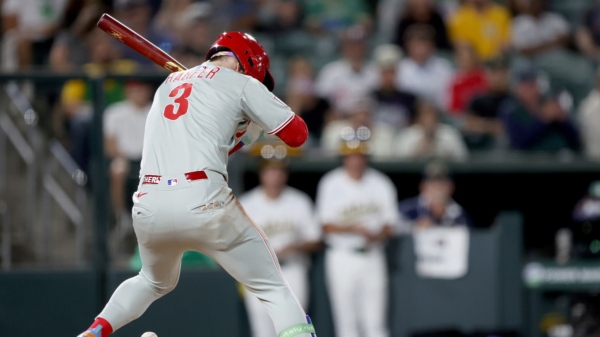 Philadelphia Phillies first baseman Bryce Harper (3) gets hit by a pitch against the Athletics during the eighth inning at Sutter Health Park.