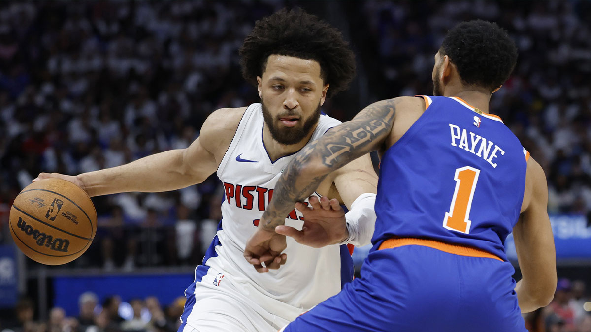 Detroit Pistons guard Cade Cunningham (2) dribbles defended by New York Knicks guard Cameron Payne (1) in the second half during game three of first round for the 2024 NBA Playoffs at Little Caesars Arena.
