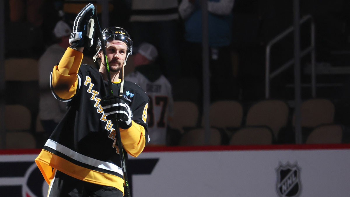 Pittsburgh Penguins defenseman Erik Karlsson (65) reacts after being named a star of the game against the Chicago Blackhawks at PPG Paints Arena.
