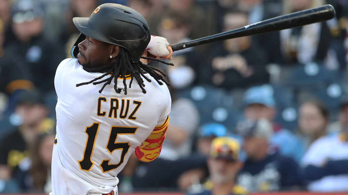 Pittsburgh Pirates center fielder Oneil Cruz (15) hits an RBI triple against the Milwaukee Brewers during the seventh inning at PNC Park.