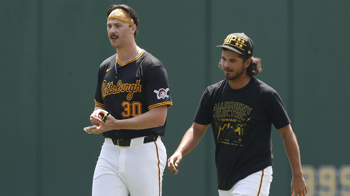 Pittsburgh Pirates pitchers Paul Skenes (left) and Jared Jones (right) walk in the outfield before the game against the Atlanta Braves at PNC Park.