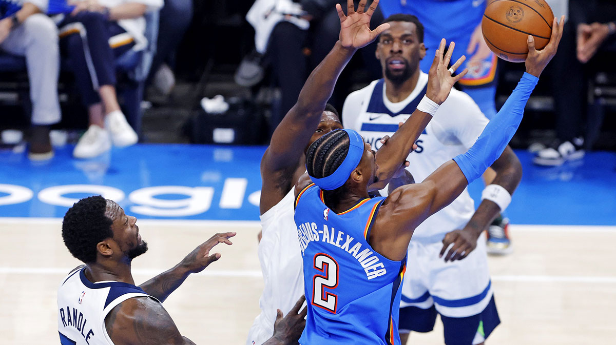 Oklahoma City Thunder guard Shai Gilgeous-Alexander (2) shoots the ball against Minnesota Timberwolves forward Julius Randle (30) during the first quarter in game five of the western conference finals for the 2025 NBA Playoffs at Paycom Center.