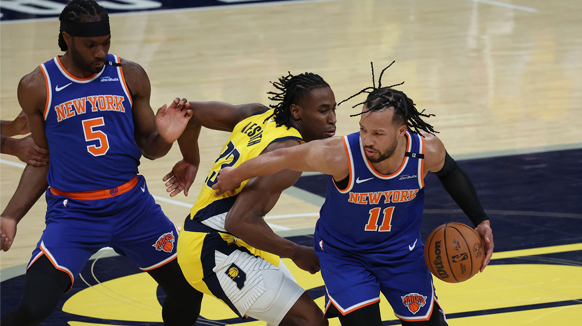New York Knicks guard Jalen Brunson (11) drives to the hoop past Indiana Pacers forward Aaron Nesmith (23) during the first quarter of game four of the eastern conference finals for the 2025 NBA Playoffs at Gainbridge Fieldhouse.