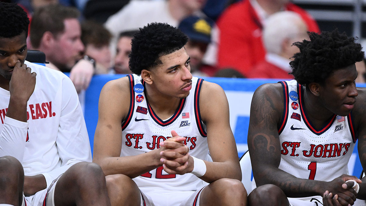 St. John's Red Storm guard RJ Luis Jr. (12), guard Kadary Richmond (1) and teammates on the bench during the second half of a second round men’s NCAA Tournament game against the Arkansas Razorbacks at Amica Mutual Pavilion.