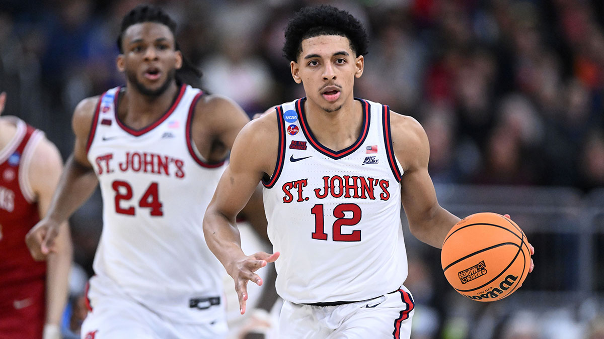 St. John's Red Storm guard RJ Luis Jr. (12) dribbles during the second half of a second round men’s NCAA Tournament game against the Arkansas Razorbacks at Amica Mutual Pavilion.