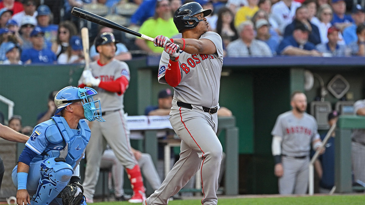 Boston Red Sox designated hitter Rafael Devers (11) hits an RBI double in the third inning against the Kansas City Royals at Kauffman Stadium.