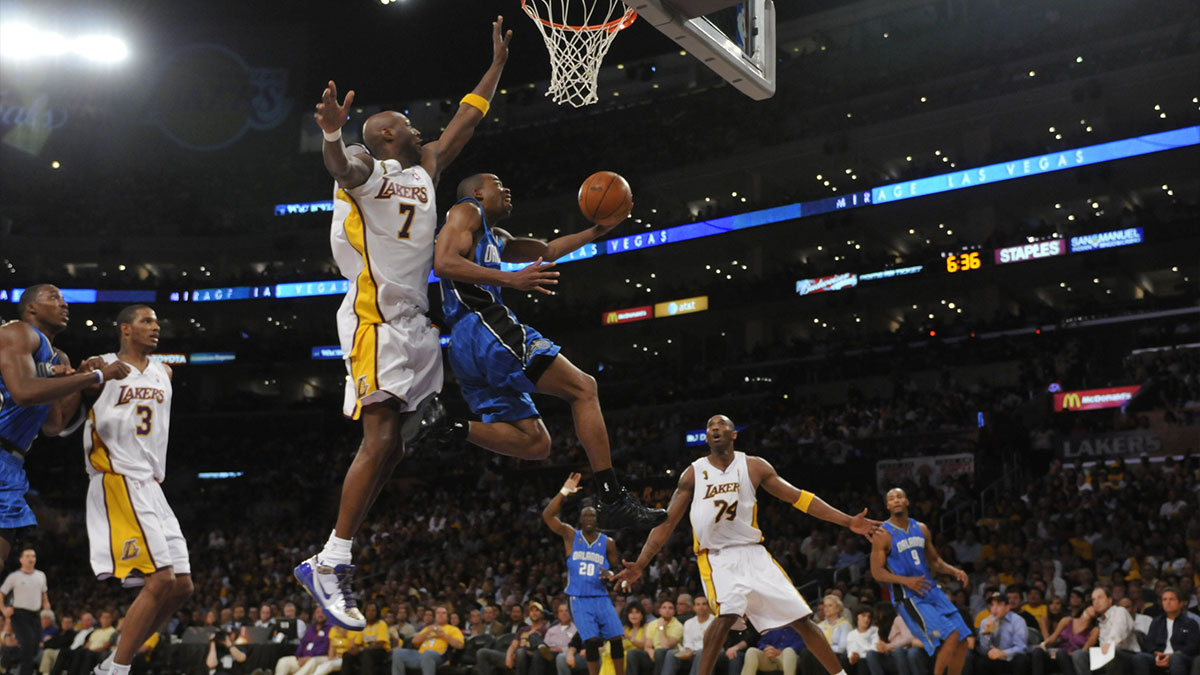 Orlando's Rafer Alston drives for a layup against Lakers Lamar Odom during game two of the NBA Finals. Los Angeles Lakers host the Orlando Magic at the Staples Center in Los Angeles, CA.