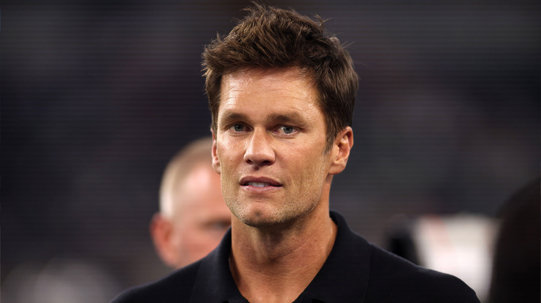 Former NFL player Tom Brady on the field before the game between the Dallas Cowboys and the Las Vegas Raiders at AT&T Stadium.