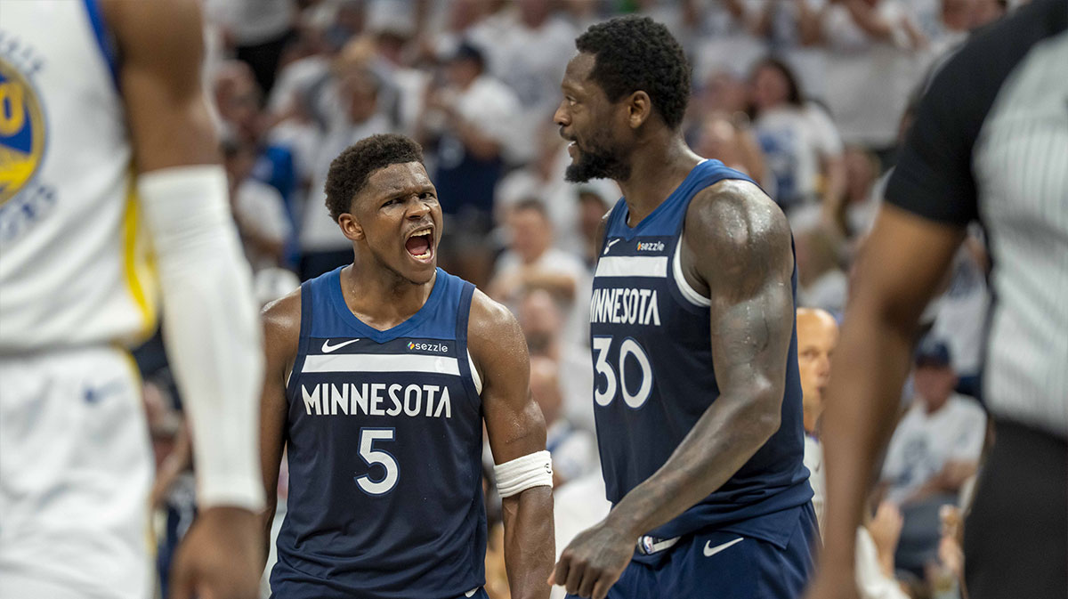 Minnesota Timberwolves guard Anthony Edwards (5) celebrates with Minnesota Timberwolves forward Julius Randle (30) after making a shot against the Golden State Warriors in the first half during game five of the second round for the 2025 NBA Playoffs at Target Center.