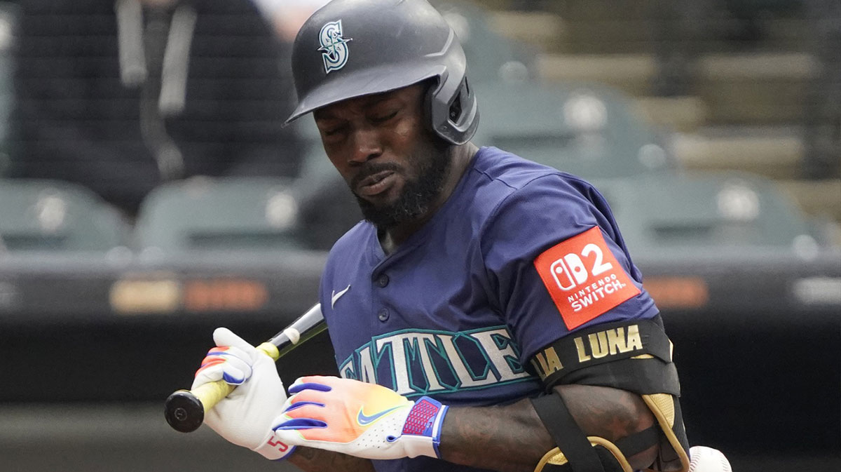 Seattle Mariners outfielder Randy Arozarena (56) is hit by a pitch during the third inning against the Chicago White Sox at Rate Field.