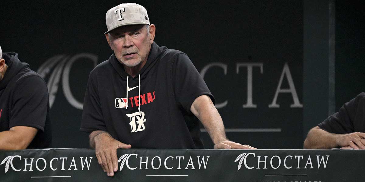 Texas Rangers manager Bruce Bochy (15) looks on from the dugout during the first inning against the Houston Astros at Globe Life Field.