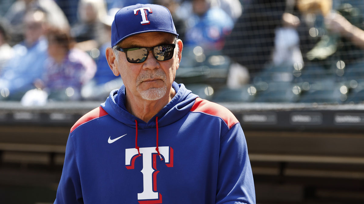 Texas Rangers manager Bruce Bochy (15) looks on from the dugout before a baseball game against the Chicago White Sox at Rate Field.