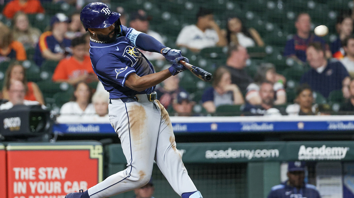 Tampa Bay Rays third baseman Junior Caminero (13) hits a two run RBI double against the Houston Astros in the eighth inning at Daikin Park.