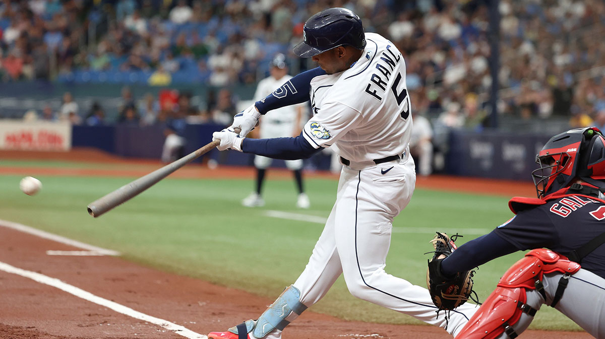 Tampa Bay Rays shortstop Wander Franco (5) singles against the Cleveland Guardians during the first inning at Tropicana Field.