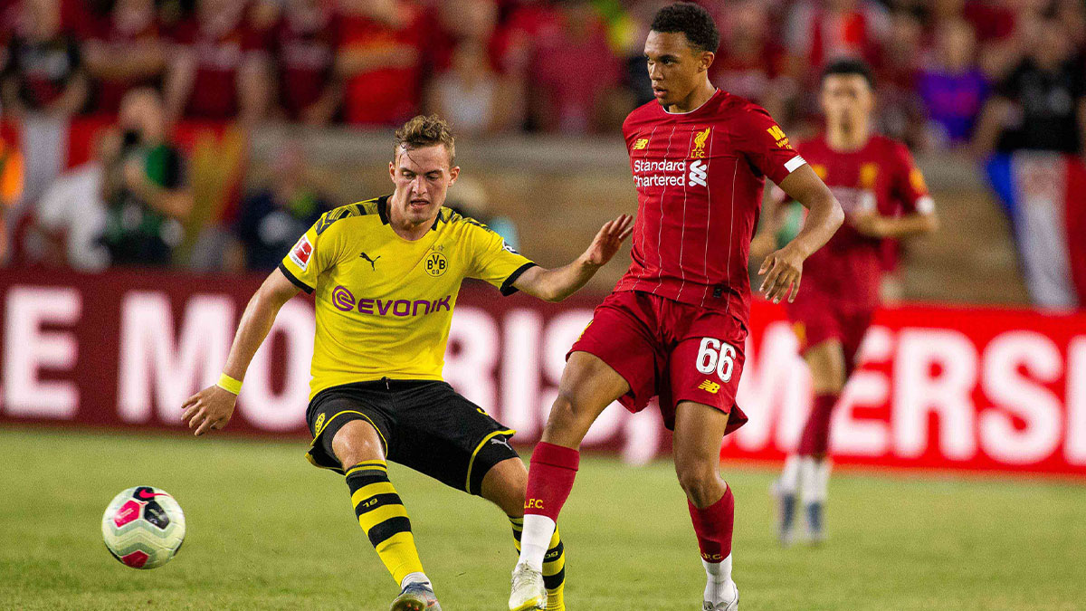 Liverpool defender Trent Alexander-Arnold (66) passes the ball away from Borussia Dortmund forward Jacob Bruun Larsen (34) in the second half of a pre-season preparation soccer match at Notre Dame.