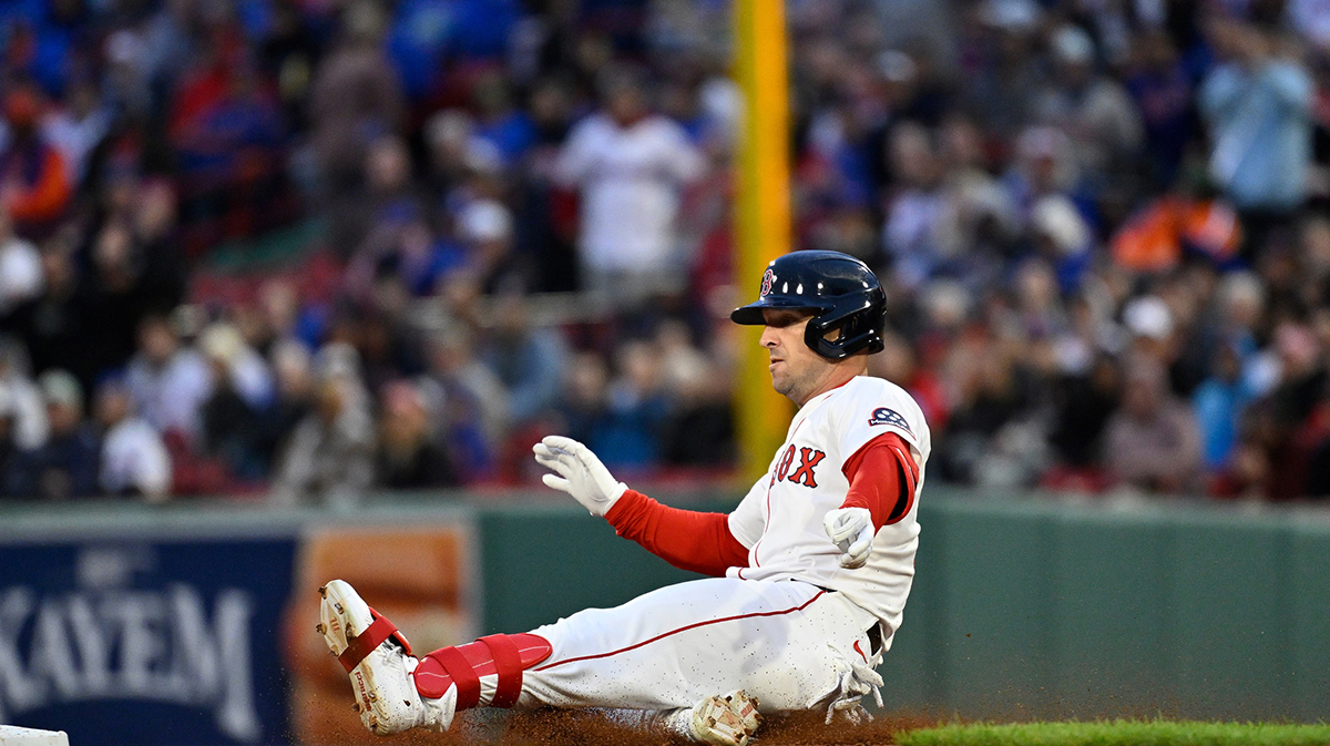 Boston Red Sox third baseman Alex Bregman (2) slides into second base during the third inning against the New York Mets at Fenway Park.