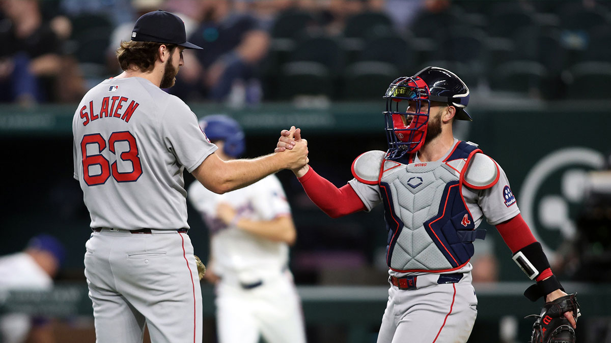 Boston Red Sox pitcher Justin Slaten (63) is congratulated by Boston Red Sox catcher Connor Wong (12) after the game against the Texas Rangers at Globe Life Field.