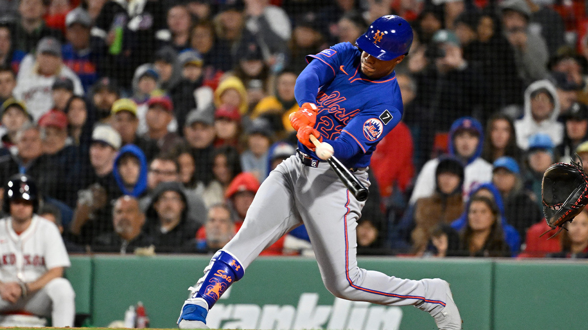 New York Mets right fielder Juan Soto (22) hits a single against the Boston Red Sox during the sixth inning at Fenway Park.