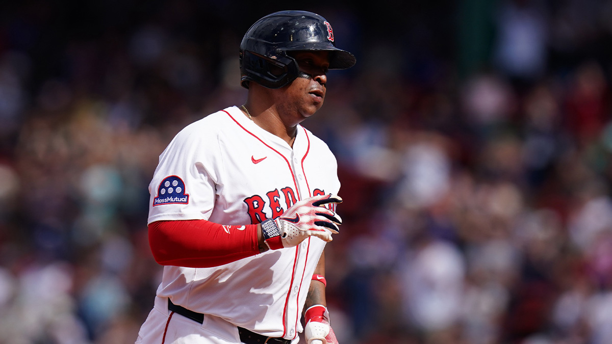 Boston Red Sox designated hitter Rafael Devers (11) hits a home run against the Texas Rangers in the seventh inning at Fenway Park.