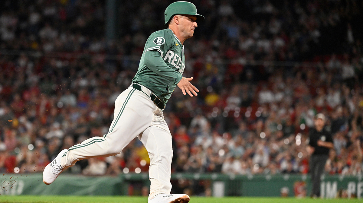Boston Red Sox third base Alex Bregman (2) scores on a RBI single by shortstop Trevor Story (not pictured) during the ninth inning against the Atlanta Braves at Fenway Park.