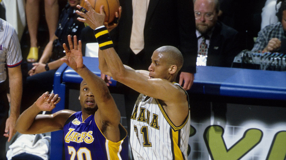 Indiana Pacers guard Reggie Miller (31) is defended by Los Angeles Lakers guard Brian Shaw (20) during the 2000 NBA Finals at Canseco Fieldhouse.