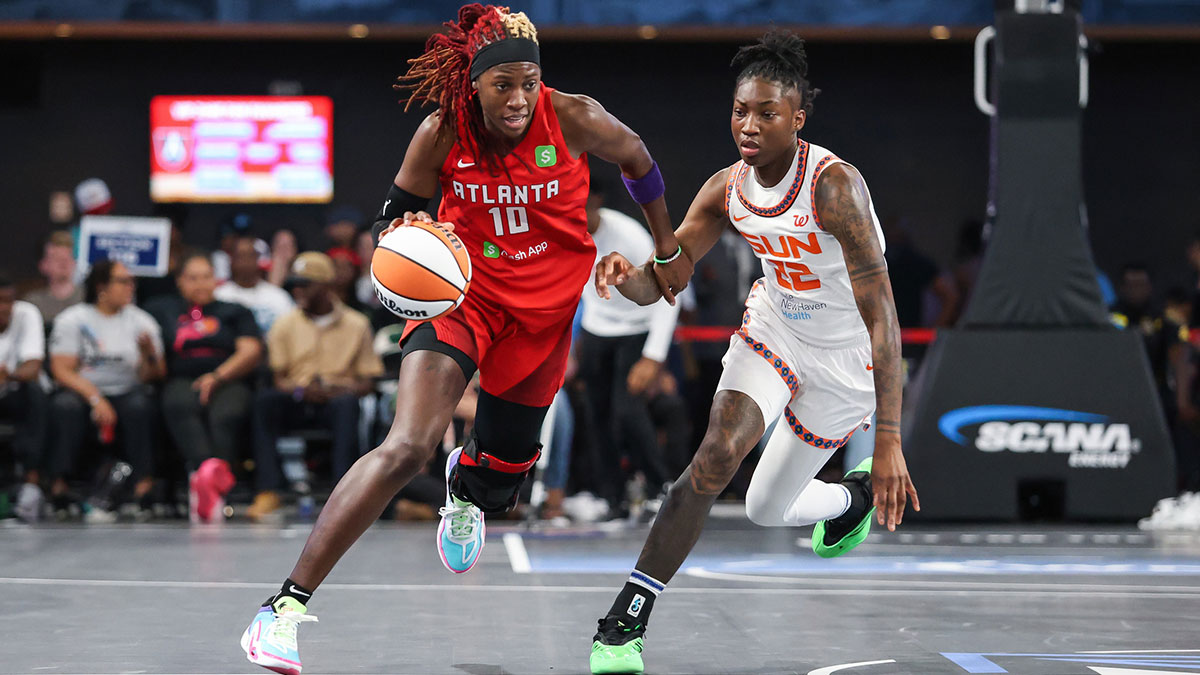 Atlanta Dream guard Rhyne Howard (10) dribbles the ball down the court against Connecticut Sun guard Saniya Rivers (22) during the third quarter at Gateway Center Arena at College Park.