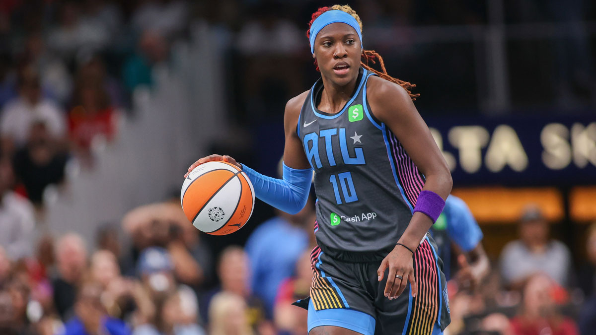 Atlanta Dream guard Rhyne Howard (10) dribbles against the Indiana Fever in the first half at State Farm Arena.
