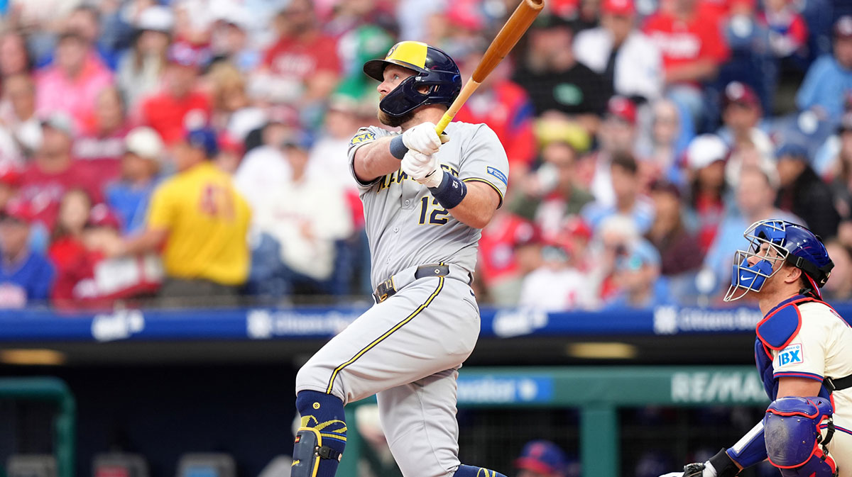 May 31, 2025; Philadelphia, Pennsylvania, USA; Milwaukee Brewers infielder Rhys Hoskins (12) hits a three-run home run against the Philadelphia Phillies in the first inning at Citizens Bank Park.