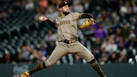 San Diego Padres relief pitcher Robert Suarez (75) pitches in the ninth inning against the Colorado Rockies at Coors Field.