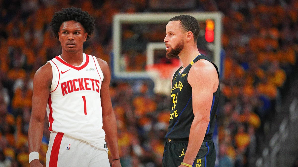 Rockets forward Amen Thompson (1) stands next to Golden State Warriors guard Stephen Curry (30) during a break in the action in the second quarter of game six of the first round for the 2025 NBA Playoffs at Chase Center